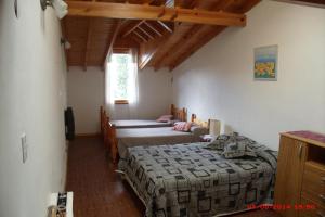 Ένα ή περισσότερα κρεβάτια σε δωμάτιο στο Colibrí House