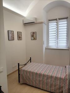 Un pat sau paturi într-o cameră la L'amurusa