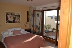 Postel nebo postele na pokoji v ubytování Hostal La Garita