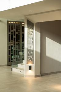 a building with a sign on a wall at Amarilla Golf Residences in San Miguel de Abona