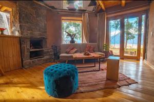 a living room with a couch and a table at Cabaña Maras Peru in Maras