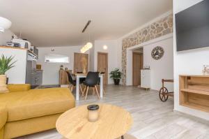 a living room with a couch and a table at Apartment Tarle in Vodice