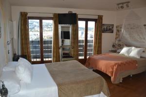 Postel nebo postele na pokoji v ubytování Hostal La Garita