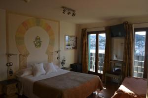 Postel nebo postele na pokoji v ubytování Hostal La Garita