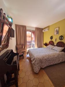 Postel nebo postele na pokoji v ubytování Hotel Tachfine
