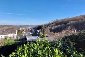 a view of a village with a hill in the background at House of Haiger Ferienwohnung mit Charme in Haiger