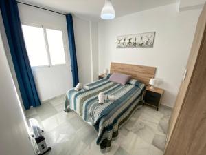 Posteľ alebo postele v izbe v ubytovaní LAS INFANTAS HOME