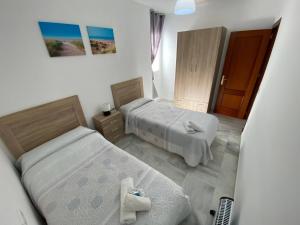Posteľ alebo postele v izbe v ubytovaní LAS INFANTAS HOME