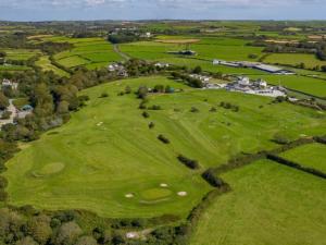 an overhead view of a large green golf course at Wheal Amelia Lodge in Helston