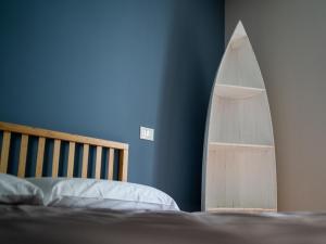 Кровать или кровати в номере Hurban Apartments Muggia