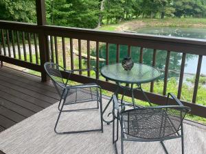 a table and two chairs on a porch at The Mockingbird in Logan