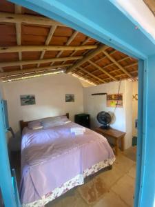 a bedroom with a bed in a room at Restaurante e Repousares do Nildo in Icapuí
