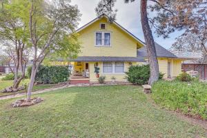 a yellow house with a yard at Eclectic Wildomar Home 6 Mi to Santa Rosa Plateau in Wildomar