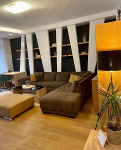 a living room with a couch and a table at Resident Apartment in Košice