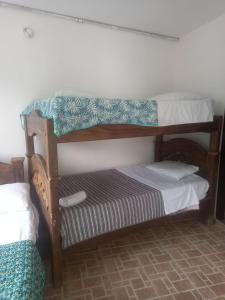 a couple of bunk beds in a room at hotel los heroes in La Vega