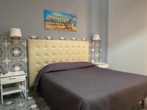 Un pat sau paturi într-o cameră la La Nuova Girgenti