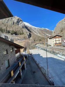a view of a building with a snow covered mountain at Miramountains in La Thuile
