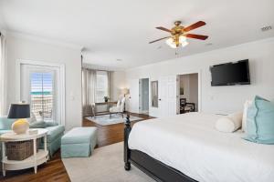 a bedroom with a bed and a ceiling fan at Dock n Dune in Seagrove Beach