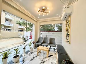 a living room with chairs and a table at Stay Inn Kaashvi (A unit of Admire India Tourism Pvt. Ltd.) in Varanasi