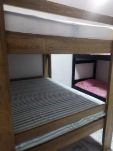 a wooden bunk bed with a bunk bedscribed at CASA FINCA TURBACO VIA CAÑAVERAL in Turbaco