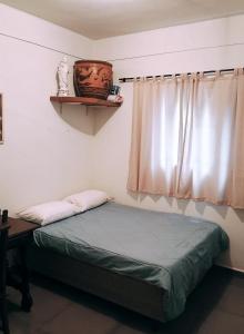 Giường trong phòng chung tại Chácara Tipuana