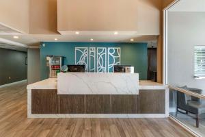 an empty lobby with a counter in a room at Best Western Plus Vineyard Inn in Livermore +37 photos