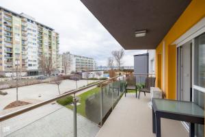 an apartment balcony with a view of a street at Admiral Luxury Stúdió Apartman By BLTN in Siófok