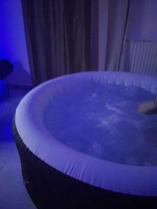 a large blue bath tub in a room at Mirto Luxury Appartment in Heraklio Town