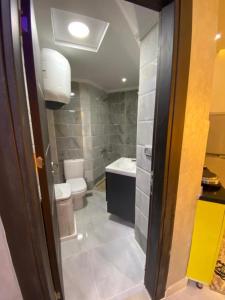 a bathroom with a toilet and a sink at GREEN PORTO Matrouh Chalets in Marsa Matruh