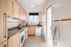 a kitchen with a sink and a dishwasher at Casita Caracol - peace and quiet in Denia