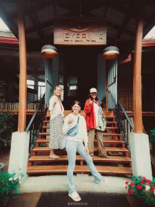 a group of people standing on the steps of a building at Eyeful Ella in Ella