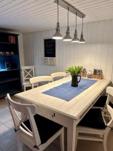 a dining room table with a potted plant on it at Träumerei Veitsch in Veitsch