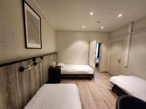 A bed or beds in a room at Albert - Rooms