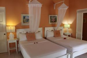 Letto o letti in una camera di Sugarapple Bequia