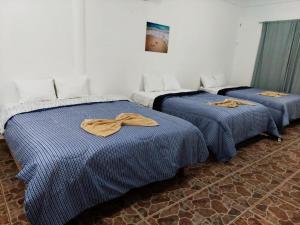Postel nebo postele na pokoji v ubytování HOTEL PUERTO REAL