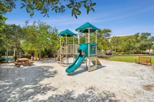 a playground with a slide in a park at Hp 24w Condo in Rosemary Beach