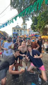 a group of people posing for a picture at a festival at Sobrado Fundição in Recife