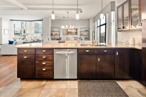 a kitchen with a large island with a dishwasher at Larimer Square Luxury - Office - Downtown Hub in Denver