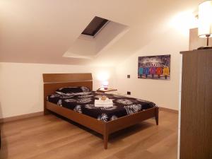 a bedroom with a bed in a room at Casa Diletta Luxury in Cavedine