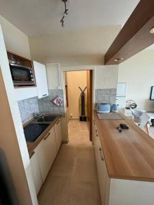 a kitchen with a sink and a counter top at #101 MARINA RIVIERA BAY - Studio 30m2 avec terrasse vue Mer in Villeneuve-Loubet