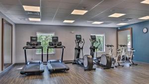 a gym with several exercise bikes in a room at Hampton Inn & Suites Keene in Keene