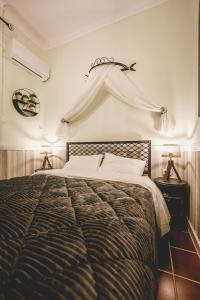 a bedroom with a large bed in a room at pension Acronafplia ( building C ) in Nafplio