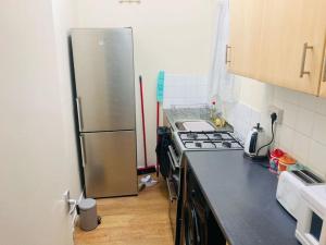 Kuchyň nebo kuchyňský kout v ubytování Largess Luxury Apartment + 5 fotografií