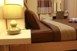 Posteľ alebo postele v izbe v ubytovaní Navavilla Serviced Apartment
