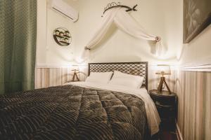 a bedroom with a large bed in a room at pension Acronafplia ( building C ) in Nafplio
