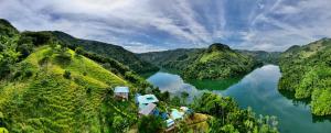 an aerial view of a lake between two mountains at Ecohotel Campo Alegre Norcasia Caldas in Norcasia