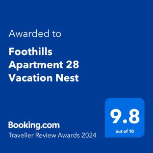 En logo, et sertifikat eller et firmaskilt på Foothills Apartment 28 Vacation Nest