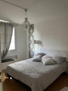 מיטה או מיטות בחדר ב-Élégant appartement - Accor Arena Bercy