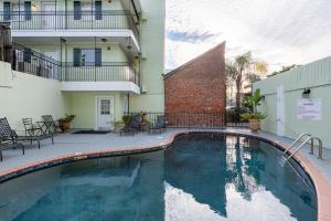 a swimming pool in front of a building at French Quarter Suites Hotel in New Orleans