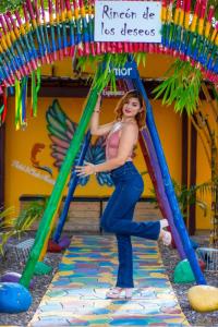a woman is standing on a play structure at HOTEL CLUB MORAZAN in San Lorenzo